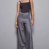 Jeans grigio vita bassa wide leg con strass