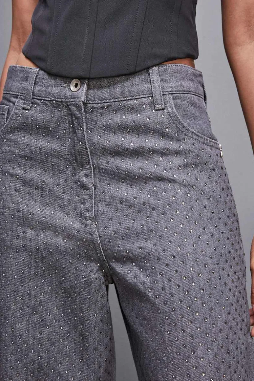 Jeans grigio vita bassa wide leg con strass