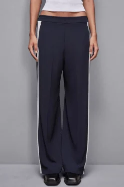 Pantalone vita bassa con banda colorata