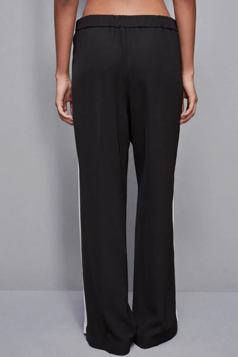 Pantalone vita bassa con banda colorata