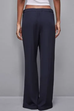 Pantalone vita bassa con banda colorata