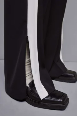 Pantalone vita bassa con banda colorata