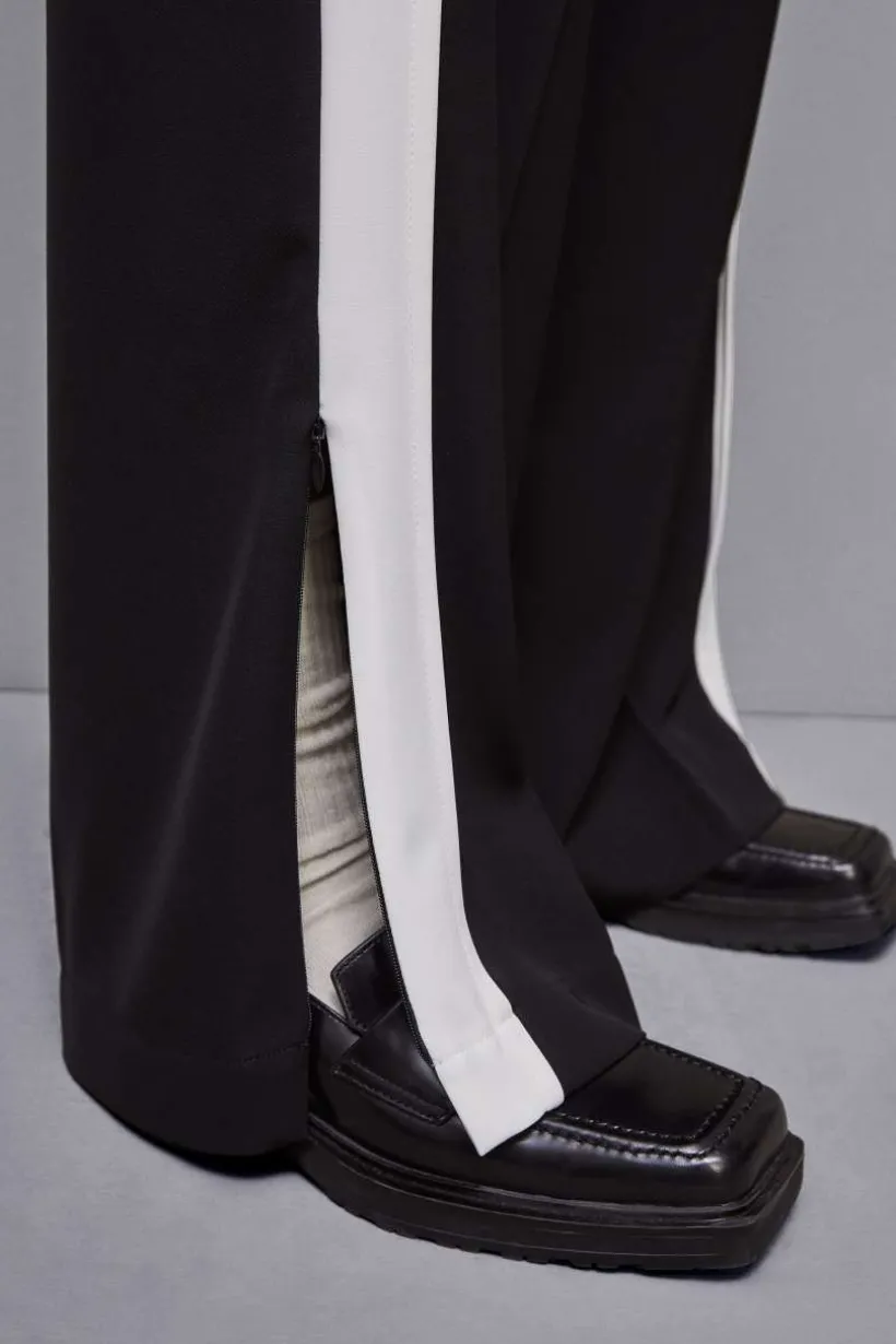 Pantalone vita bassa con banda colorata