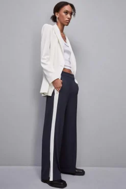 Pantalone vita bassa con banda colorata