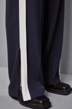 Pantalone vita bassa con banda colorata