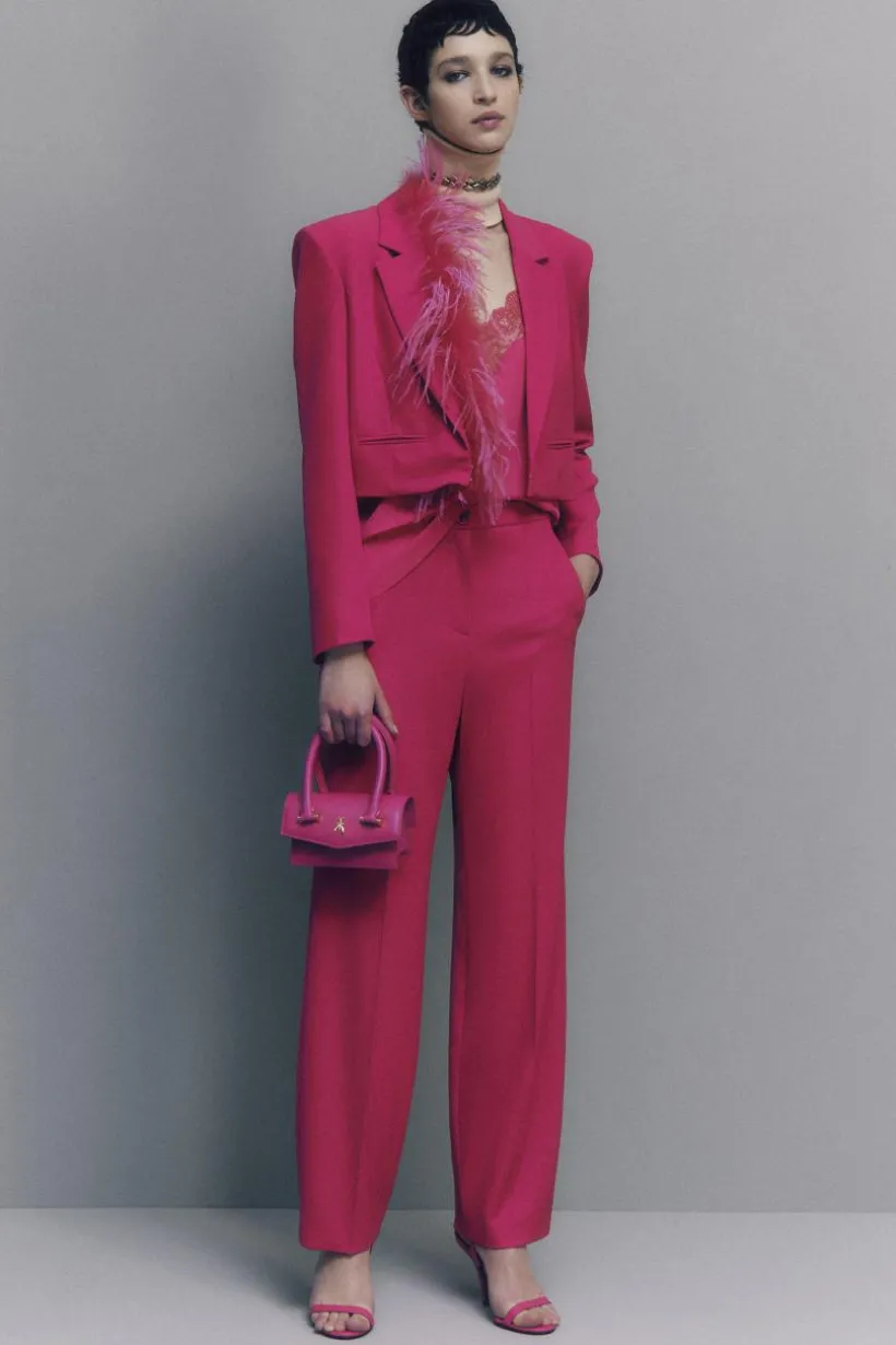Pantaloni con pieghe in tessuto stretch