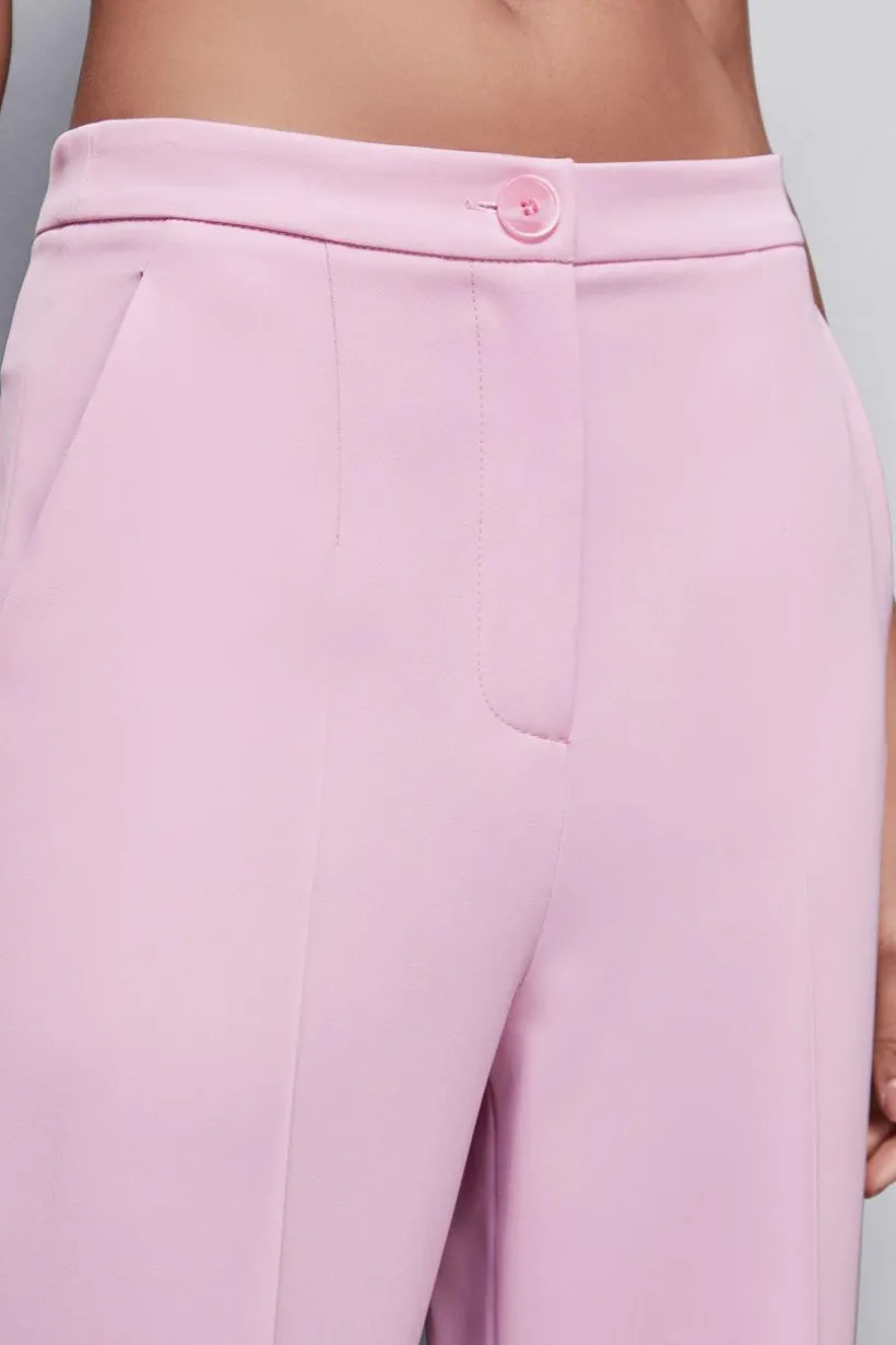 Pantaloni con pieghe in tessuto stretch