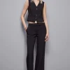 Pantaloni vita bassa in twill