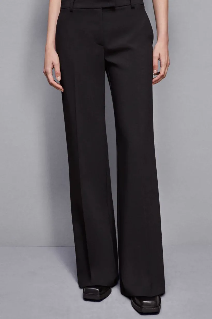 Pantaloni vita bassa in twill