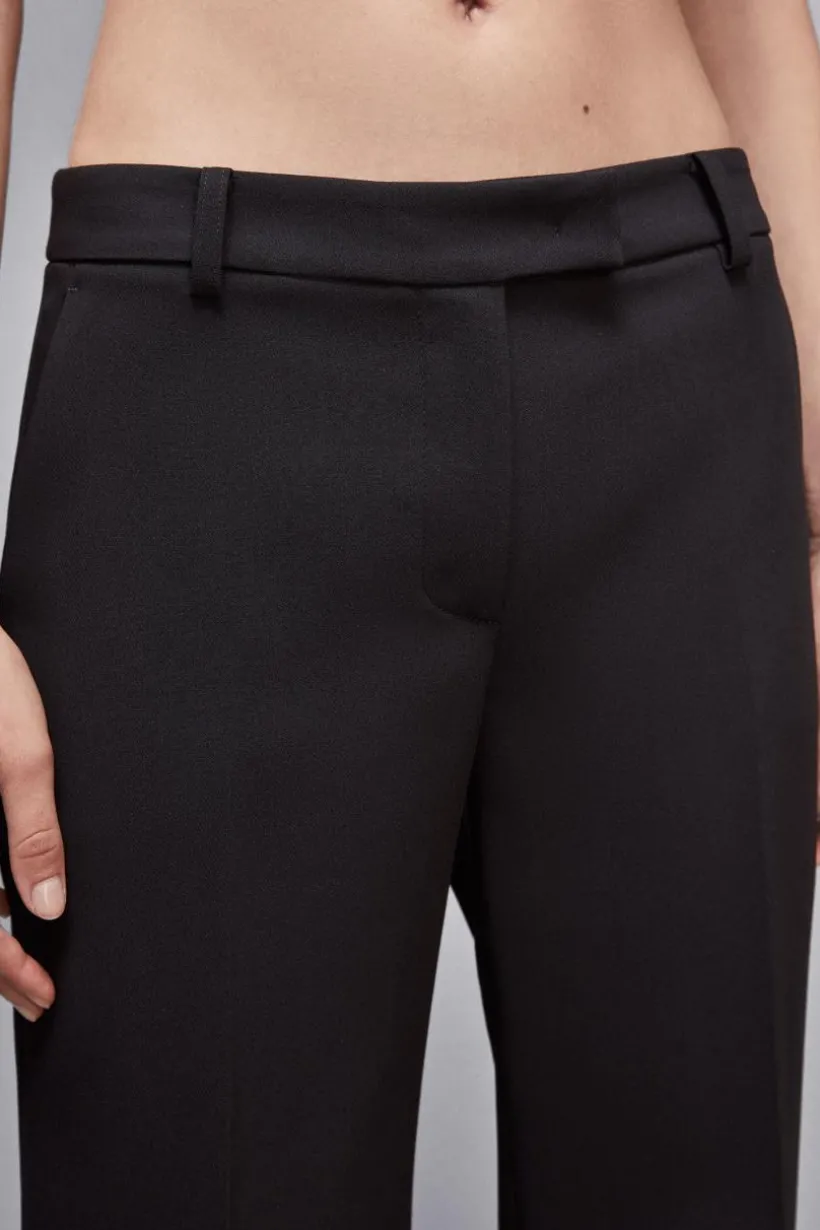 Pantaloni vita bassa in twill