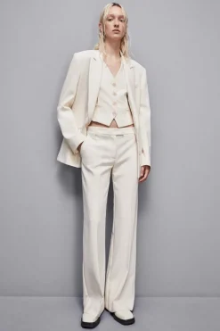 Pantaloni vita bassa in twill