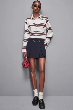 Polo cropped con manica lunga