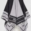 Poncho double face con frange
