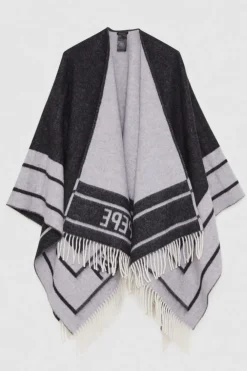 Poncho double face con frange