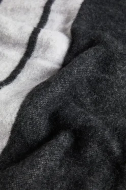 Poncho double face con frange