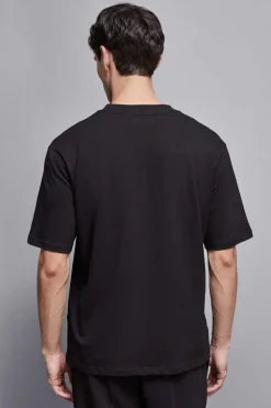 T-shirt con applicazione borchie